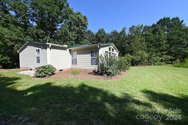 exterior space featuring crawl space and a lawn