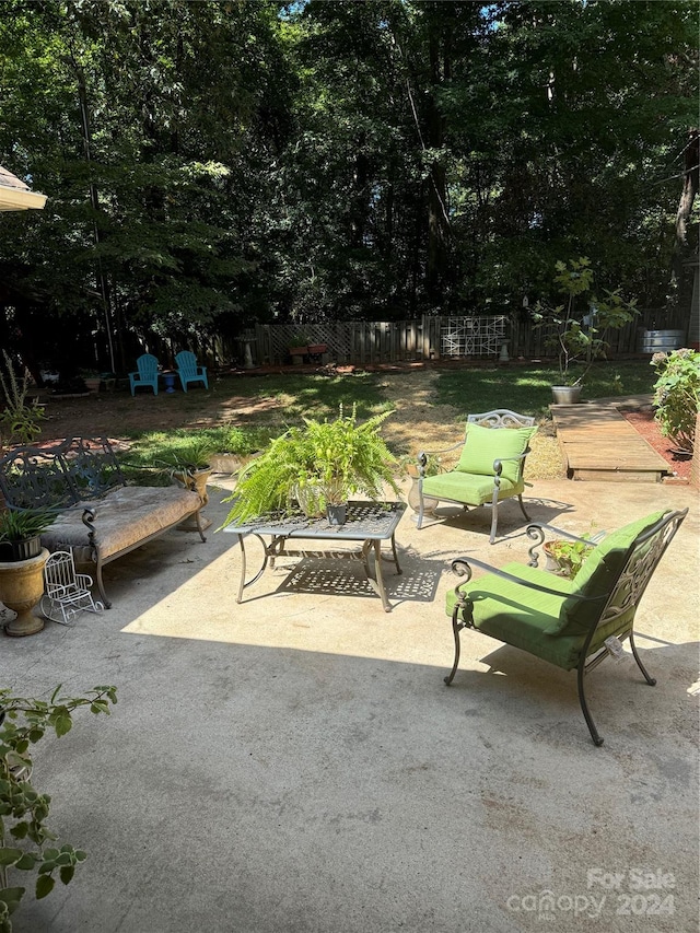 view of patio with a fire pit