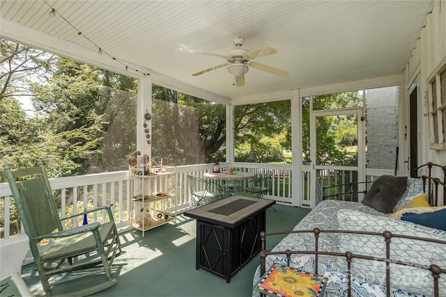 sunroom / solarium with ceiling fan