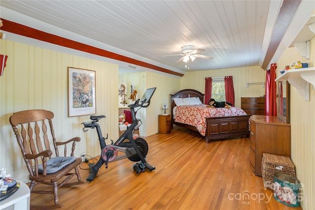 bedroom featuring ceiling fan, light hardwood / wood-style floors, and wooden ceiling