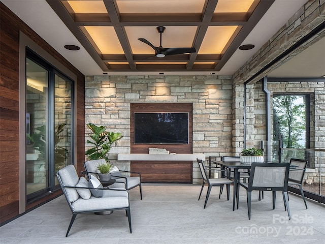 interior space with ceiling fan