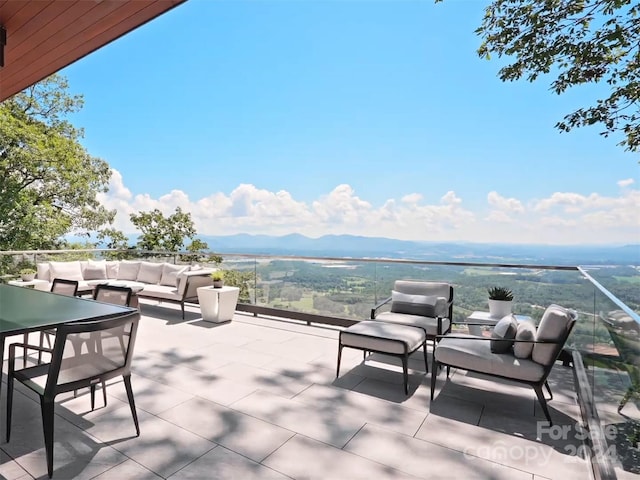 view of patio featuring a mountain view and an outdoor hangout area