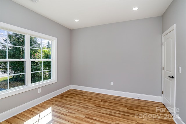 spare room featuring light hardwood / wood-style flooring