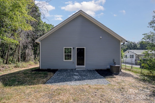 back of property featuring central AC unit