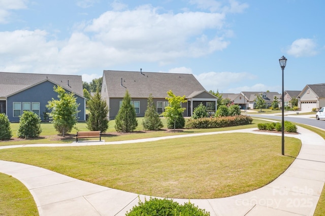 surrounding community featuring a lawn