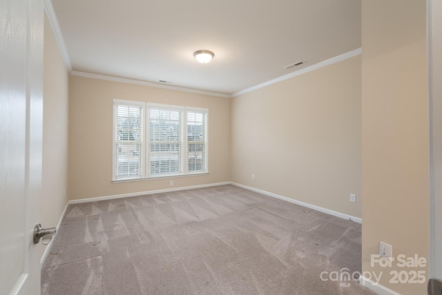 unfurnished room with crown molding and light carpet