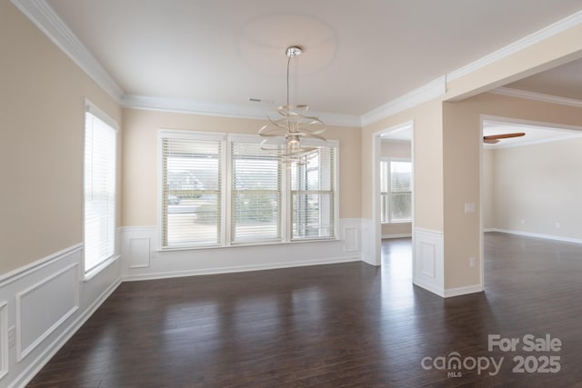 unfurnished dining area with dark hardwood / wood-style flooring and ornamental molding