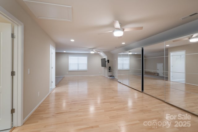 interior space with light hardwood / wood-style floors and ceiling fan