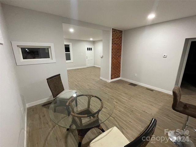 unfurnished room featuring hardwood / wood-style flooring