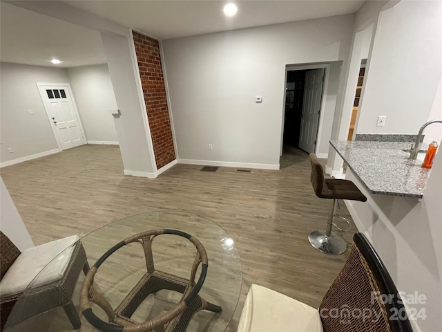 interior space featuring sink and hardwood / wood-style flooring