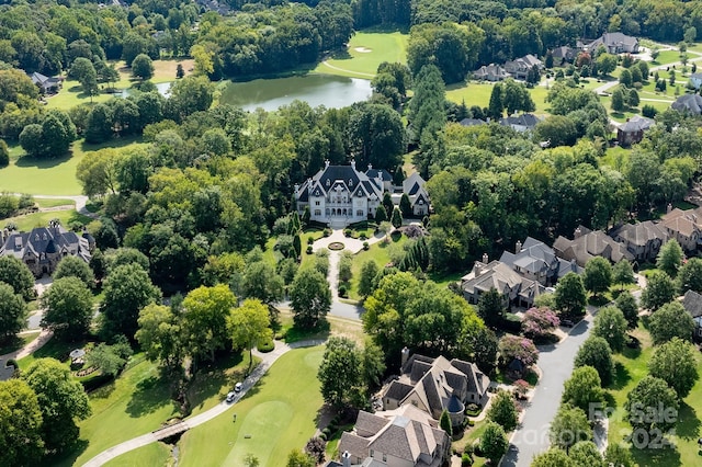 birds eye view of property featuring a residential view and a water view