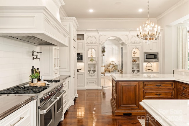 kitchen with brown cabinets, dark wood-type flooring, appliances with stainless steel finishes, white cabinets, and custom exhaust hood