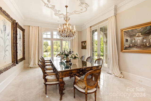 dining room with ornamental molding and a notable chandelier