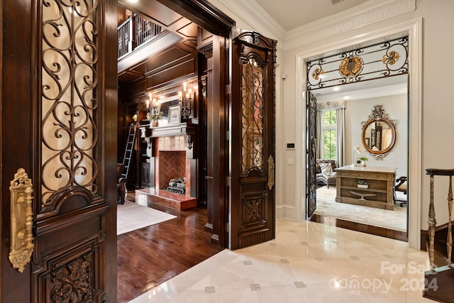 entryway featuring hardwood / wood-style flooring and ornamental molding