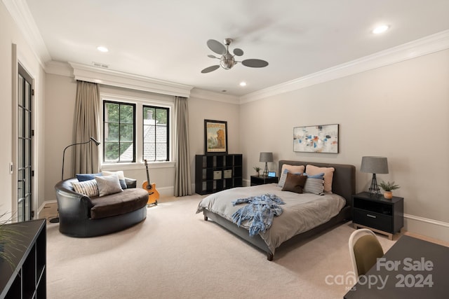 bedroom featuring ornamental molding, ceiling fan, and carpet