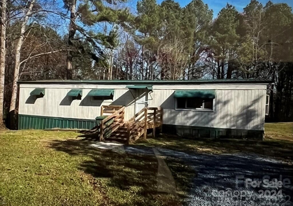 view of home's exterior featuring a yard