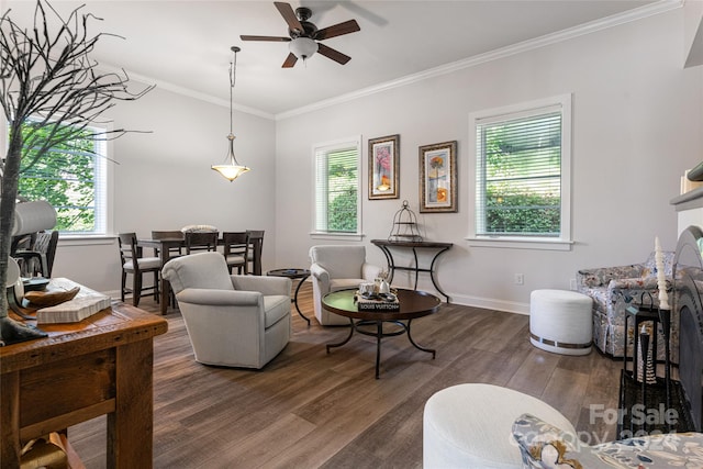 living room with dark wood-type flooring, ceiling fan, and plenty of natural light