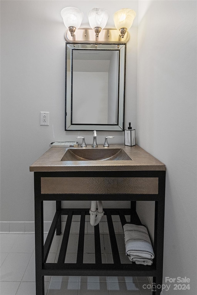 bathroom featuring tile patterned flooring and vanity