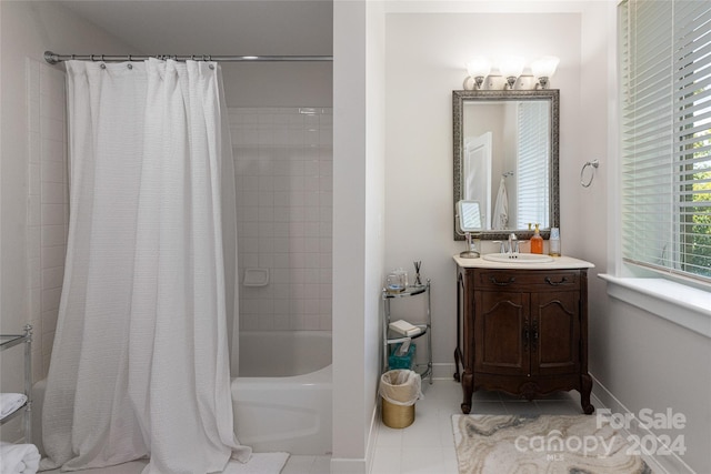 bathroom with tile patterned flooring, vanity, and shower / tub combo with curtain
