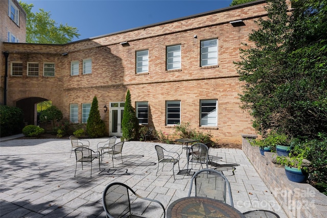 rear view of property featuring a patio