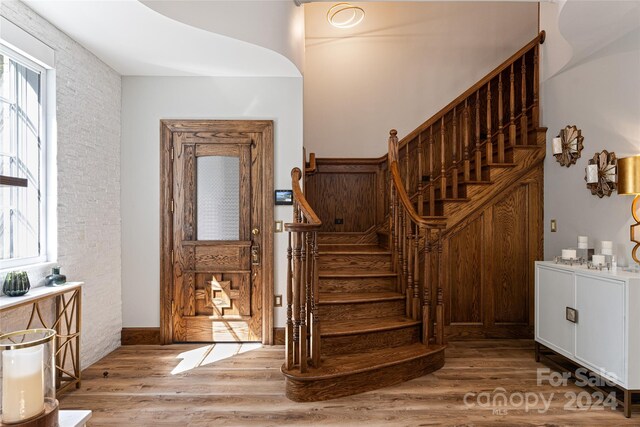 interior space featuring a healthy amount of sunlight and hardwood / wood-style flooring