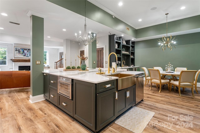 kitchen featuring an inviting chandelier and light hardwood / wood-style flooring