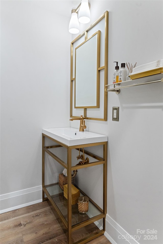 bathroom with hardwood / wood-style flooring