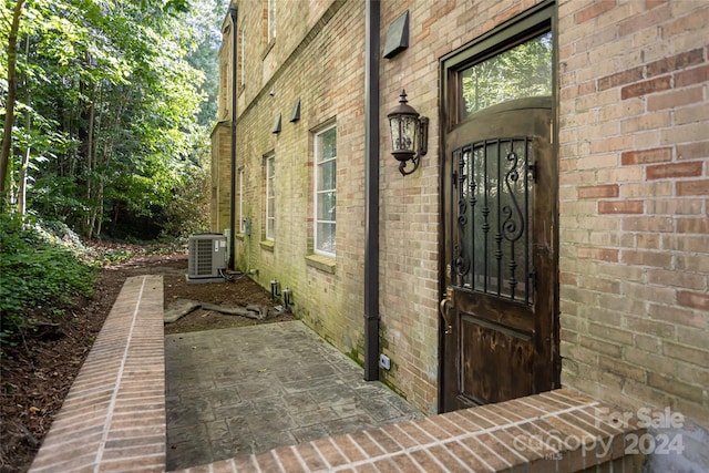 doorway to property with cooling unit