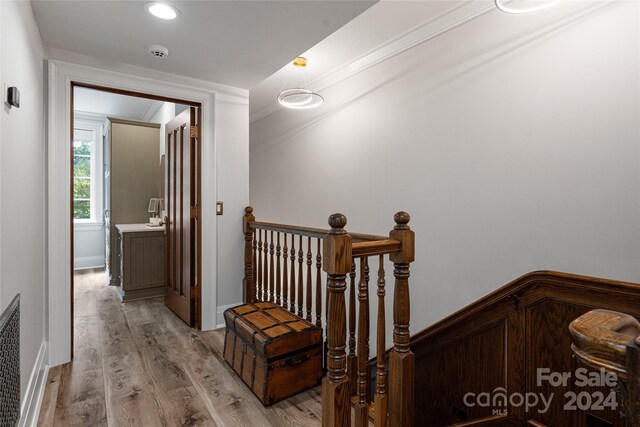 corridor with light wood-type flooring