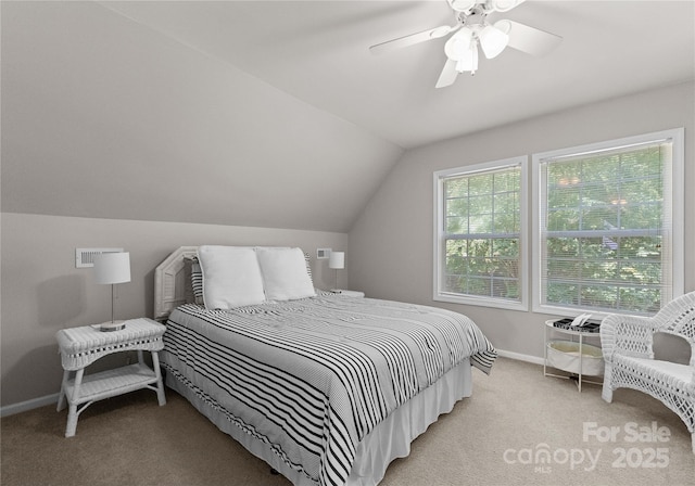 carpeted bedroom with ceiling fan and lofted ceiling