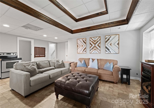 living room featuring a tray ceiling