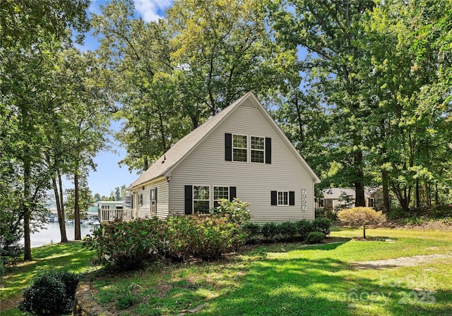 view of home's exterior with a yard