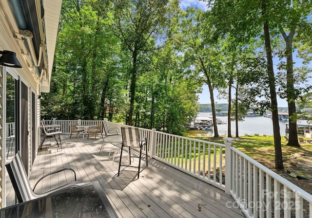 wooden deck with a water view