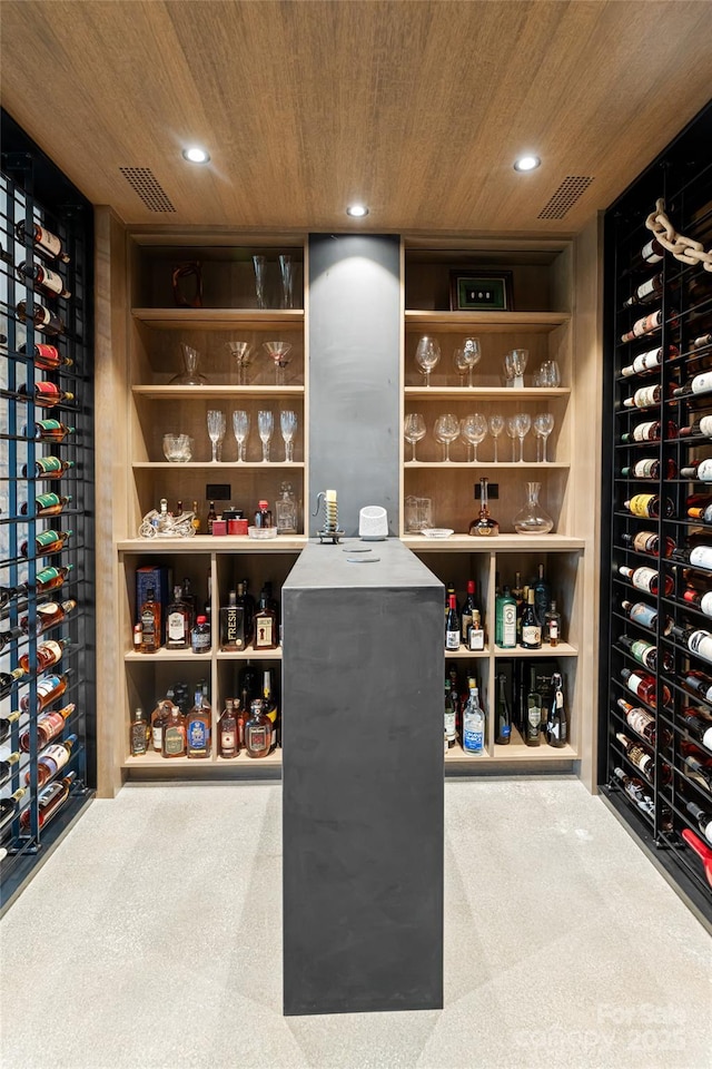 wine room with wooden ceiling