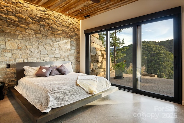 bedroom with access to exterior and wooden ceiling