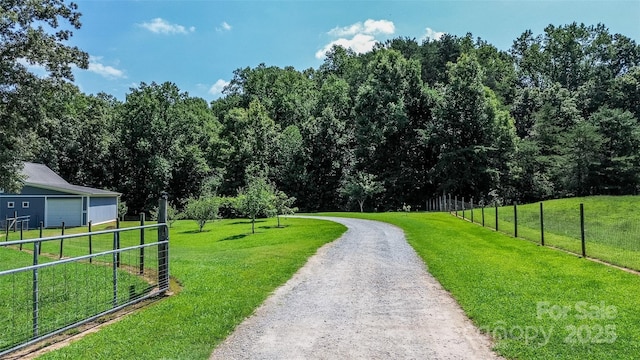 view of home's community with a yard and a rural view