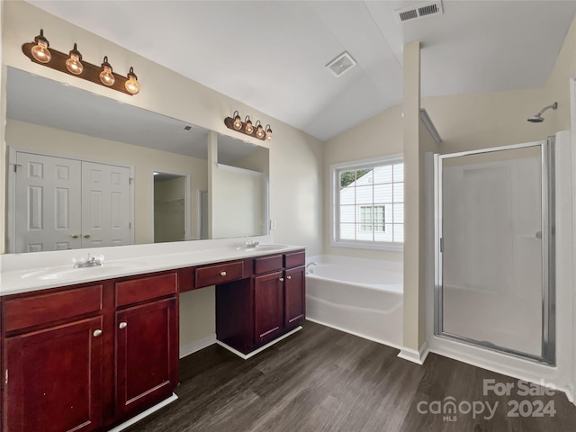 bathroom with a closet, visible vents, a sink, and a garden tub