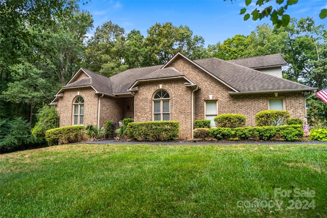 front facade with a front lawn