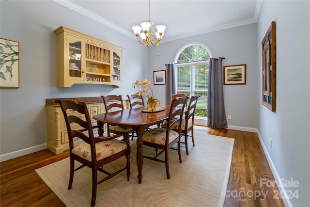 10235 Mount Holly Rd, Charlotte, NC 28214 - dining area with ornamental molding, a chandelier, and dark wood-type flooring