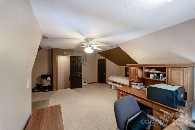 10235 Mount Holly Rd, Charlotte, NC 28214 - carpeted office space featuring a textured ceiling, vaulted ceiling, and ceiling fan