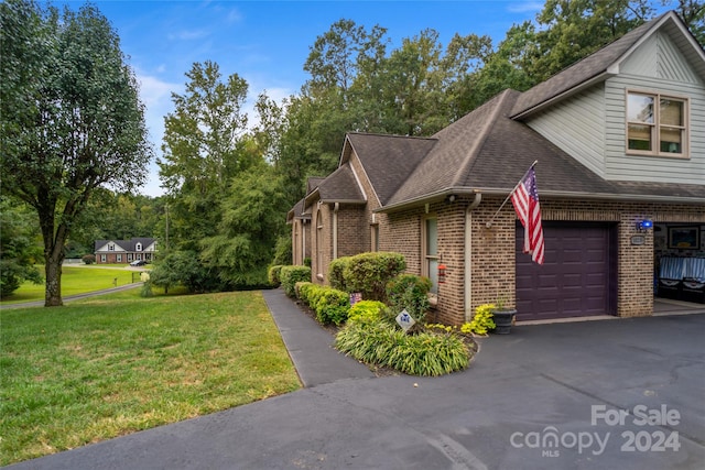 10235 Mount Holly Rd, Charlotte, NC 28214 - view of front of home with a front yard and a garage