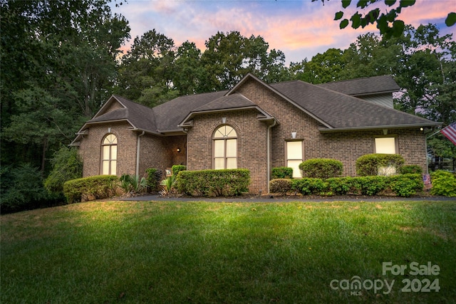 10235 Mount Holly Rd, Charlotte, NC 28214 - view of front of house with a lawn