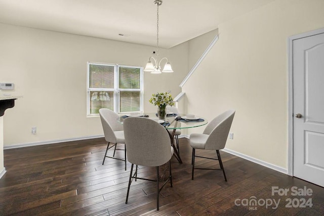 dining room featuring dark wood-type flooring and a chandelier