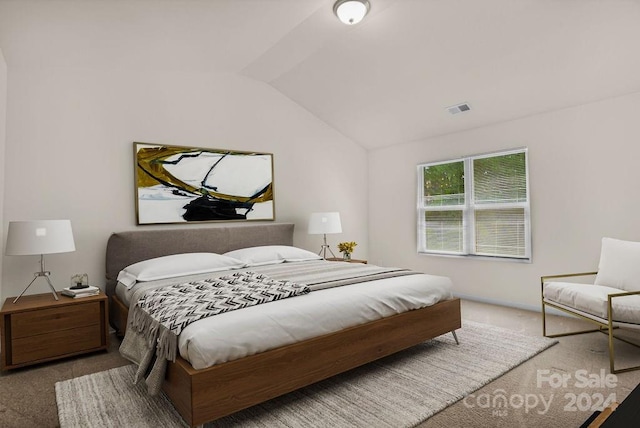 bedroom with lofted ceiling and carpet