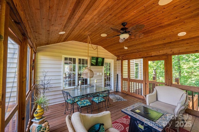 sunroom / solarium featuring ceiling fan, wood ceiling, and vaulted ceiling