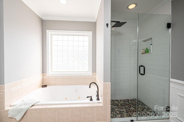 full bath featuring ornamental molding, a jetted tub, and a stall shower