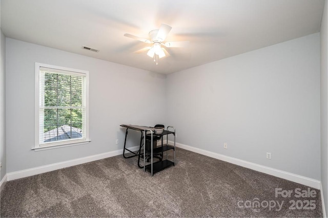 interior space with ceiling fan, carpet floors, visible vents, and baseboards