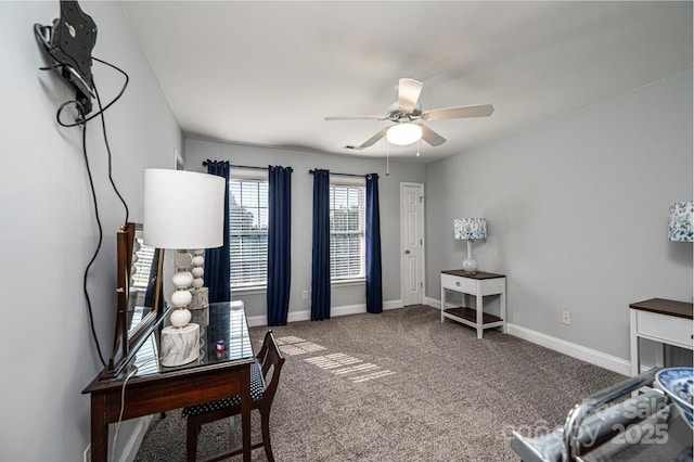 interior space featuring a ceiling fan and baseboards