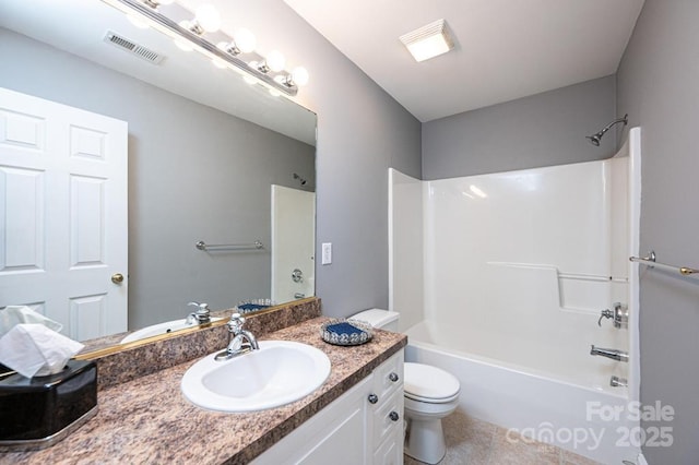 bathroom with shower / bath combination, visible vents, toilet, vanity, and tile patterned floors