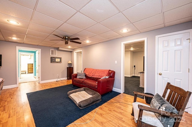 living room featuring recessed lighting, baseboards, visible vents, and light wood finished floors